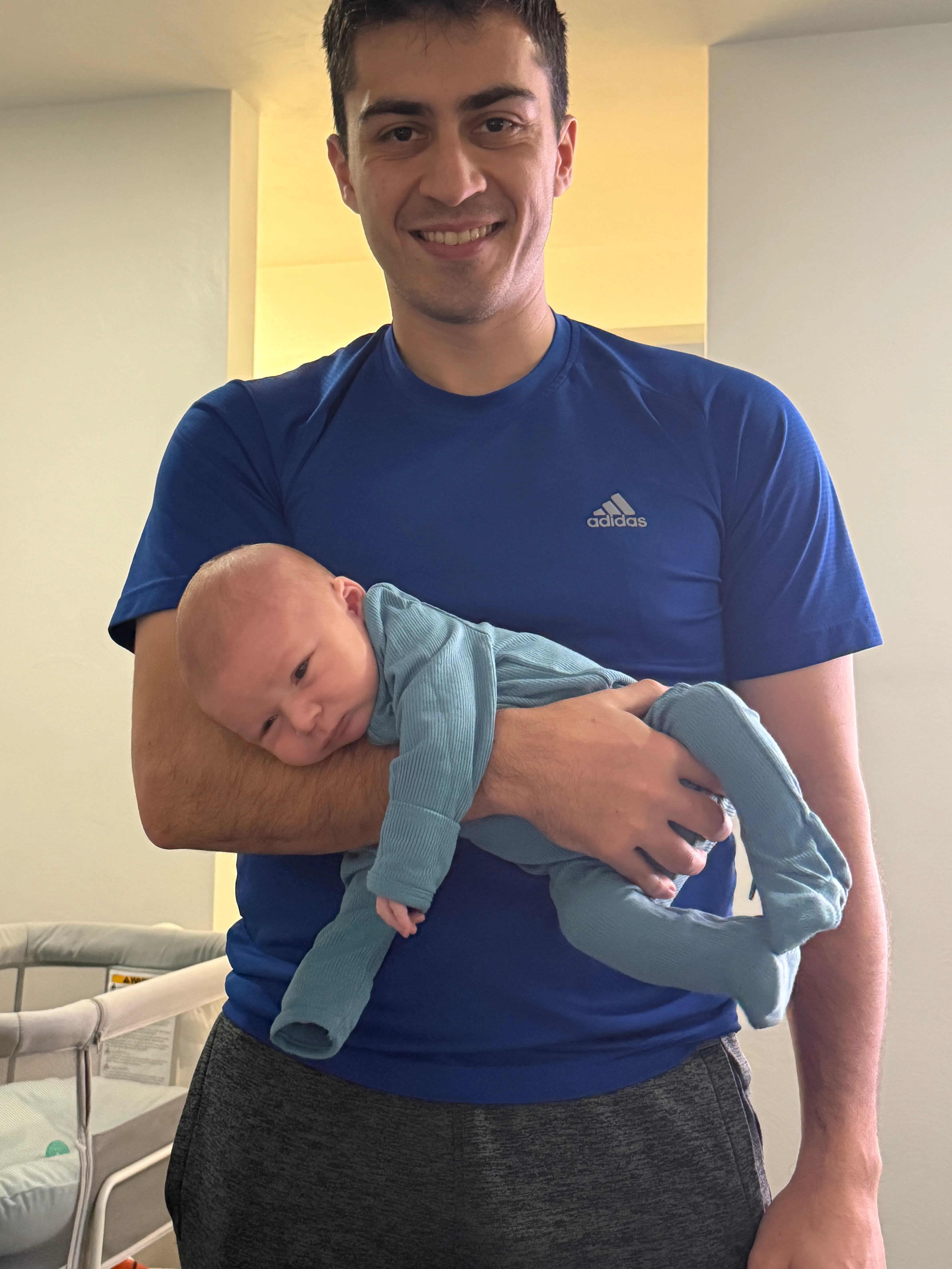 Mark holding sleeping Nolan